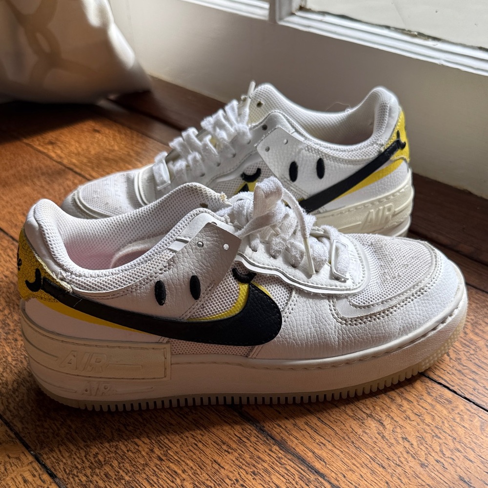 Nike Women’s Air Force 1 White and Black Sneakers with Yellow Accents